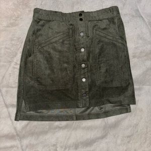 body tight skirt. buttons down the middle. fake pockets